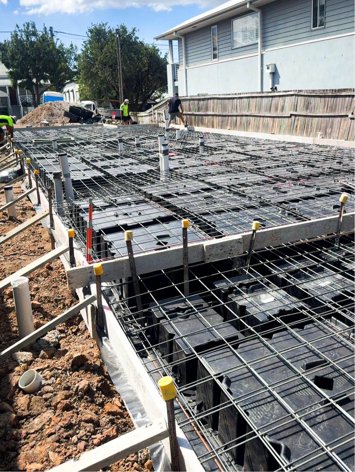 Steel reinforcement and waffle pod formwork prepared for the Annie St home's concrete slab
